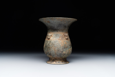 A Chinese archaic bronze ritual wine vessel with buffalo heads, 'zhi 觯', Western Zhou