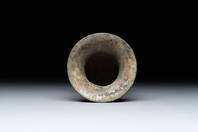 A Chinese archaic bronze ritual wine vessel with buffalo heads, 'zhi 觯', Western Zhou