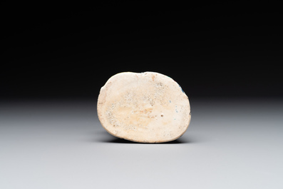 A Chinese famille rose Guanyin and a celadon-glazed dish, Chenghua mark, Qianlong/Jiaqing