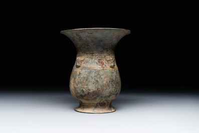 A Chinese archaic bronze ritual wine vessel with buffalo heads, 'zhi 觯', Western Zhou