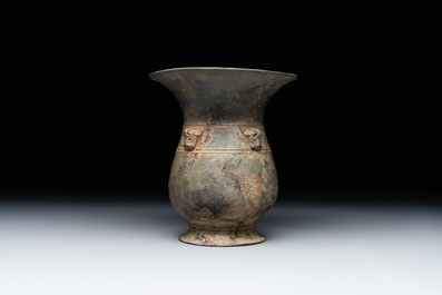 A Chinese archaic bronze ritual wine vessel with buffalo heads, 'zhi 觯', Western Zhou