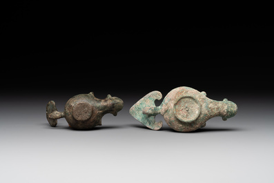 A bronze urn, a bronze canteen with relief design and a pair of bronze oil lamps, Roman Empire, 9th C. B.C/5th C.