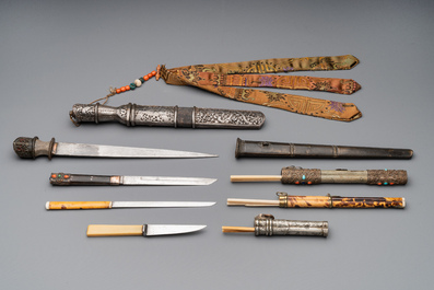 A varied collection of Chinese and Japanese eating set trousses, a Tibetan 'kapala' and two daggers, 18/19th C.