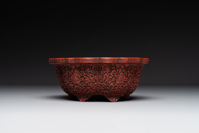 A Chinese red cinnabar lacquer jardiniere with floral design, Yongzheng/Qianlong