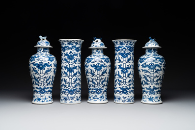 A Chinese blue and white garniture of five vases with lotus scrolls, 19th C.