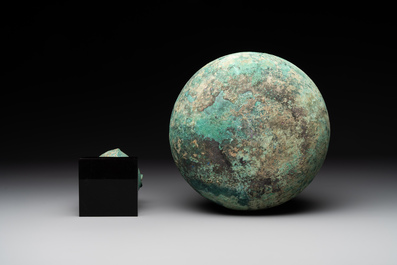 A bronze urn, a bronze canteen with relief design and a pair of bronze oil lamps, Roman Empire, 9th C. B.C/5th C.