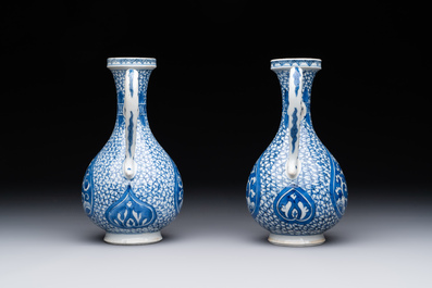 A pair of Chinese blue and white ewers with floral design, Kangxi
