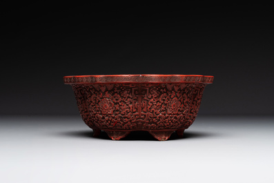 A Chinese red cinnabar lacquer jardiniere with floral design, Yongzheng/Qianlong