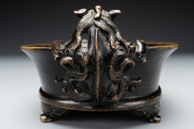 A rare Chinese bronze narcissus basin-shaped censer with dragon handles, Xuande mark, 17th C.