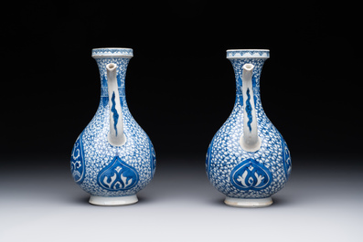A pair of Chinese blue and white ewers with floral design, Kangxi