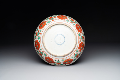 A Chinese red-and-green-enamelled 'chrysanthemum scroll' dish, Ming