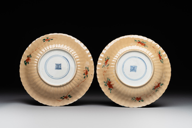 A pair of Chinese famille verte cafe-au-lait-ground cups and saucers, Kangxi