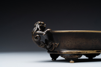 A rare Chinese bronze narcissus basin-shaped censer with dragon handles, Xuande mark, 17th C.