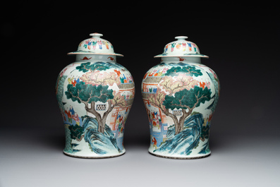 A pair of Chinese famille rose 'hundred boys' vases and covers on wooden stands, 19th C.