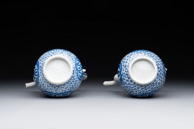 A pair of Chinese blue and white ewers with floral design, Kangxi