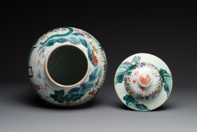 A pair of Chinese famille rose 'hundred boys' vases and covers on wooden stands, 19th C.