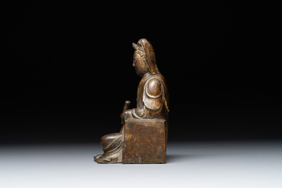 A rare Chinese parcel-gilt and lacquered pewter Guanyin, 17/18th C.