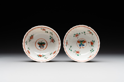 A pair of Chinese famille verte cafe-au-lait-ground cups and saucers, Kangxi