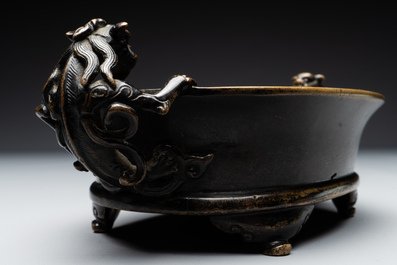 A rare Chinese bronze narcissus basin-shaped censer with dragon handles, Xuande mark, 17th C.