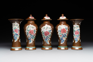A Chinese capucin-brown-ground famille rose garniture of five vases with floral design, Qianlong