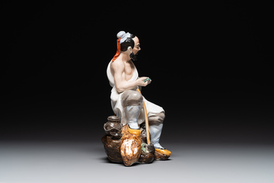 A Chinese polychrome sculpture of a lumberjack, Jingdezheng mark, 20th C.