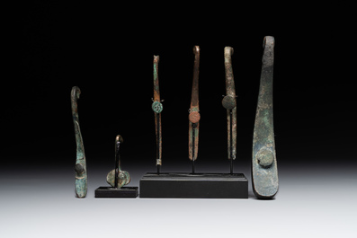 A varied collection of six Chinese bronze belt hooks, Warring States period and Western Han