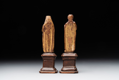Two parcel-gilt and polychromed miniature oak sculptures of Saint John The Evangelist and Saint Catherine, 16th C.