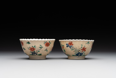 A pair of Chinese famille verte cafe-au-lait-ground cups and saucers, Kangxi