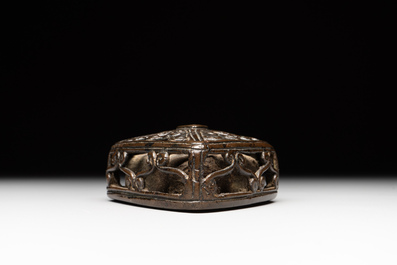 A Chinese reticulated lozenge-shaped double-walled bronze water dropper, 16th C.