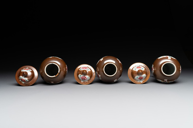 A Chinese capucin-brown-ground famille rose garniture of five vases with floral design, Qianlong