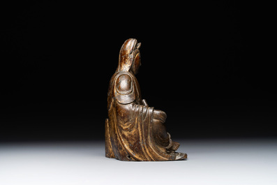 A rare Chinese parcel-gilt and lacquered pewter Guanyin, 17/18th C.