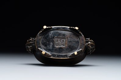 A rare Chinese bronze narcissus basin-shaped censer with dragon handles, Xuande mark, 17th C.