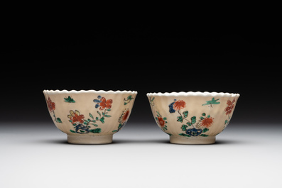A pair of Chinese famille verte cafe-au-lait-ground cups and saucers, Kangxi