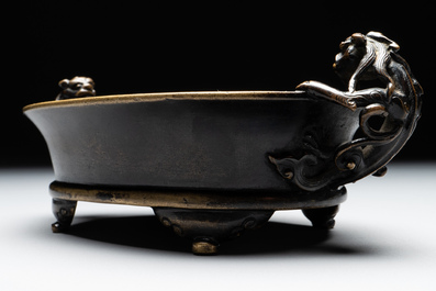 A rare Chinese bronze narcissus basin-shaped censer with dragon handles, Xuande mark, 17th C.