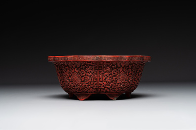 A Chinese red cinnabar lacquer jardiniere with floral design, Yongzheng/Qianlong