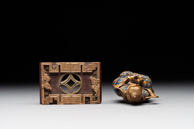 A Chinese gilt and champlev&eacute; enamelled bronze Bodhisattva on a carved stone stand, Qing