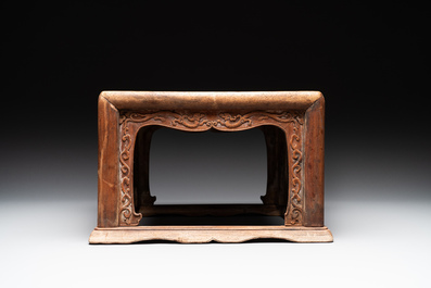 A Chinese rectangular huanghuali wooden stool with 'chilong' design, 17/18th C.