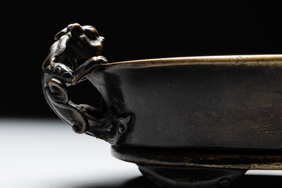 A rare Chinese bronze narcissus basin-shaped censer with dragon handles, Xuande mark, 17th C.