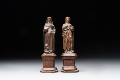 Two parcel-gilt and polychromed miniature oak sculptures of Saint John The Evangelist and Saint Catherine, 16th C.