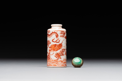 A Chinese jade carving, a tortoiseshell card holder and an iron-red snuff bottle, 19th C.