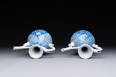 A pair of Chinese blue and white ewers with floral design, Kangxi