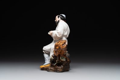 A Chinese polychrome sculpture of a lumberjack, Jingdezheng mark, 20th C.
