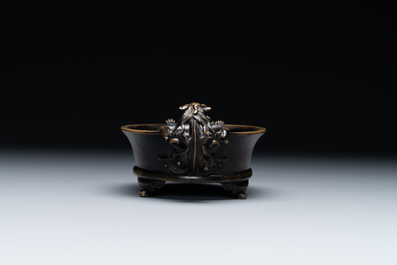 A rare Chinese bronze narcissus basin-shaped censer with dragon handles, Xuande mark, 17th C.