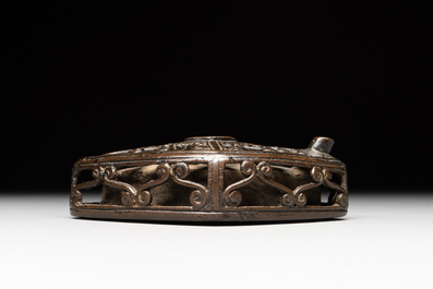 A Chinese reticulated lozenge-shaped double-walled bronze water dropper, 16th C.