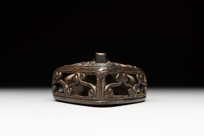 A Chinese reticulated lozenge-shaped double-walled bronze water dropper, 16th C.