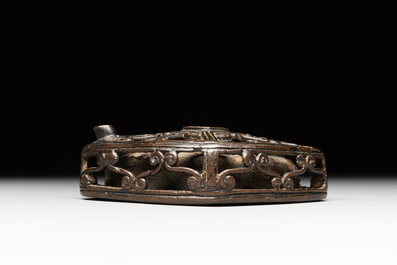 A Chinese reticulated lozenge-shaped double-walled bronze water dropper, 16th C.