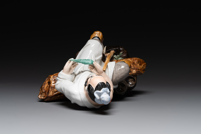 A Chinese polychrome sculpture of a lumberjack, Jingdezheng mark, 20th C.