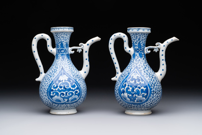 A pair of Chinese blue and white ewers with floral design, Kangxi
