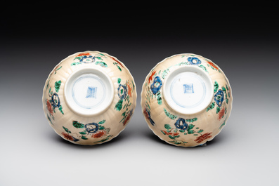 A pair of Chinese famille verte cafe-au-lait-ground cups and saucers, Kangxi