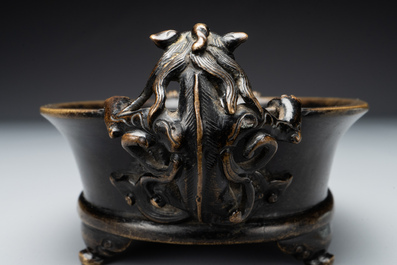 A rare Chinese bronze narcissus basin-shaped censer with dragon handles, Xuande mark, 17th C.